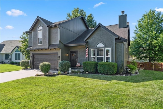 21607 W 51st St, Shawnee, KS 66226 - view of front of home featuring a chimney, a garage, and driveway