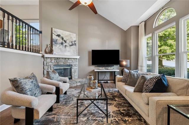 21607 W 51st St, Shawnee, KS 66226 - living area featuring high vaulted ceiling, a ceiling fan, wood finished floors, and a fireplace