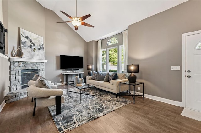 21607 W 51st St, Shawnee, KS 66226 - living area with high vaulted ceiling, ceiling fan, wood finished floors, and a stone fireplace