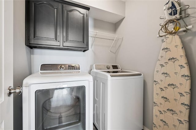 21607 W 51st St, Shawnee, KS 66226 - laundry room featuring washing machine and clothes dryer and cabinet space