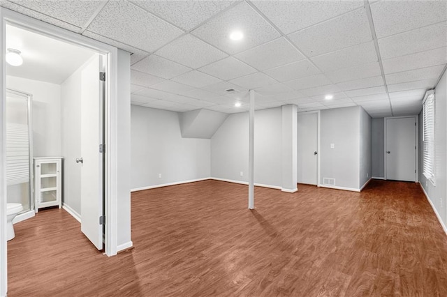 21607 W 51st St, Shawnee, KS 66226 - basement with wood finished floors, a paneled ceiling, and recessed lighting
