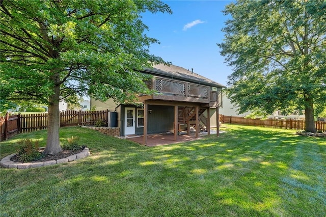 21607 W 51st St, Shawnee, KS 66226 - rear view of house with a fenced backyard, stairway, a deck, and a patio area