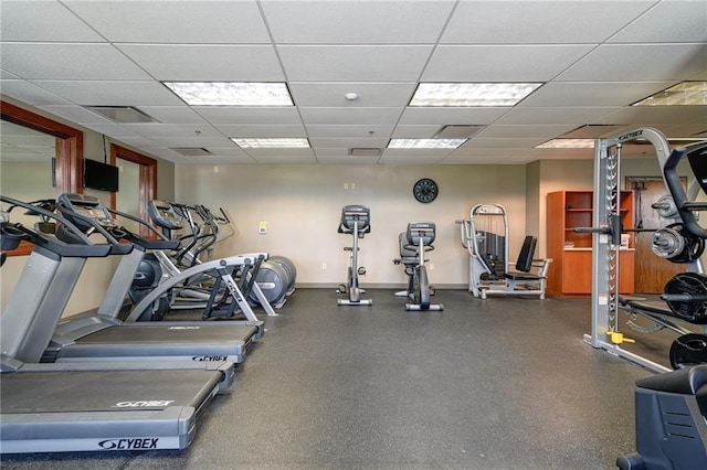 600 Mayfair Ct, Raymore, MO 64083 - gym with a paneled ceiling and baseboards