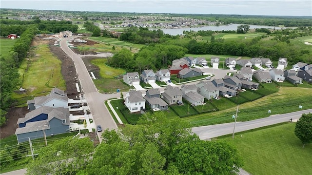 600 Mayfair Ct, Raymore, MO 64083 - aerial view of property and surrounding area with a large body of water and nearby suburban area