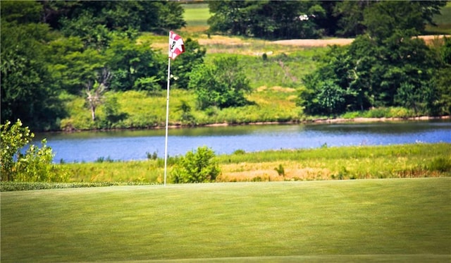 600 Mayfair Ct, Raymore, MO 64083 - view of property's community featuring a water view and a yard