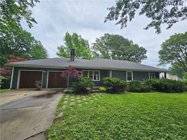 11306 E 45th St, Kansas City, MO 64133 - ranch-style home with a garage, a chimney, driveway, and a front lawn
