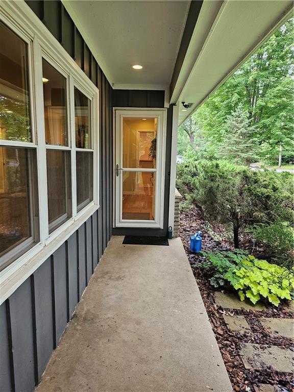 11306 E 45th St, Kansas City, MO 64133 - entrance to property featuring board and batten siding