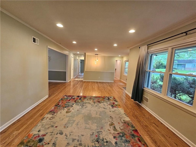 11306 E 45th St, Kansas City, MO 64133 - empty room with ornamental molding, baseboards, recessed lighting, and light wood finished floors