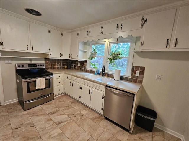 11306 E 45th St, Kansas City, MO 64133 - kitchen featuring stainless steel appliances, decorative backsplash, and light countertops