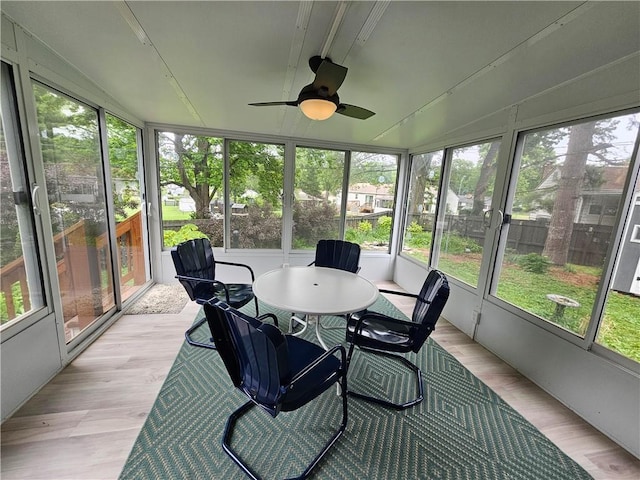 11306 E 45th St, Kansas City, MO 64133 - sunroom / solarium featuring ceiling fan and outdoor dining space