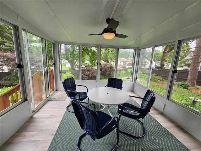 11306 E 45th St, Kansas City, MO 64133 - sunroom featuring ceiling fan and outdoor dining space