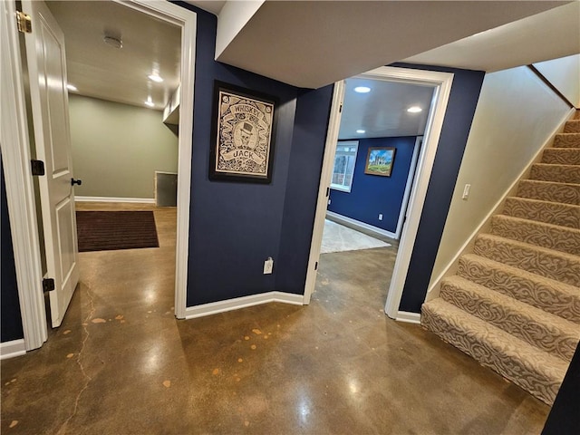 11306 E 45th St, Kansas City, MO 64133 - hallway featuring baseboards, concrete flooring, stairs, and recessed lighting