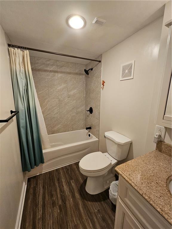 11306 E 45th St, Kansas City, MO 64133 - full bathroom featuring vanity, wood finished floors, shower / tub combo with curtain, and toilet