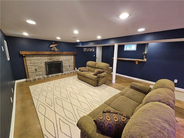 11306 E 45th St, Kansas City, MO 64133 - living area featuring baseboards, recessed lighting, and a stone fireplace