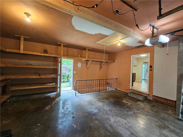 11306 E 45th St, Kansas City, MO 64133 - garage featuring a garage door opener