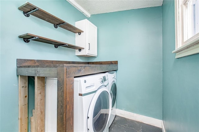 212 S Delaware St, Tonganoxie, KS 66086 - washroom with washer and dryer, baseboards, cabinet space, and a textured ceiling