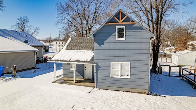 212 S Delaware St, Tonganoxie, KS 66086 - view of snow covered rear of property
