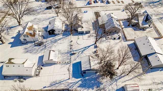 212 S Delaware St, Tonganoxie, KS 66086 - snowy aerial view featuring a residential view