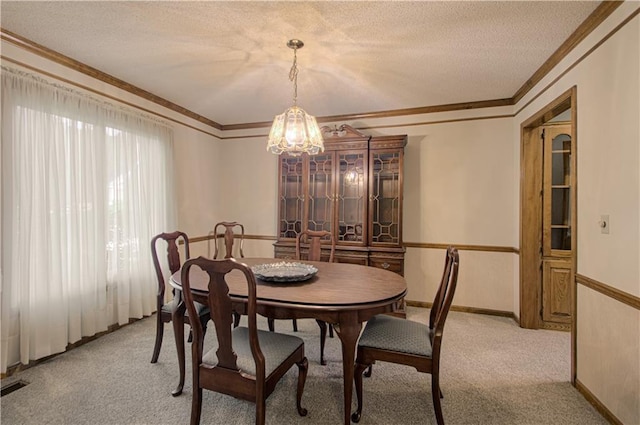 17725 W 68th Ter, Shawnee, KS 66217 - dining space with a chandelier, crown molding, light colored carpet, a textured ceiling, and baseboards