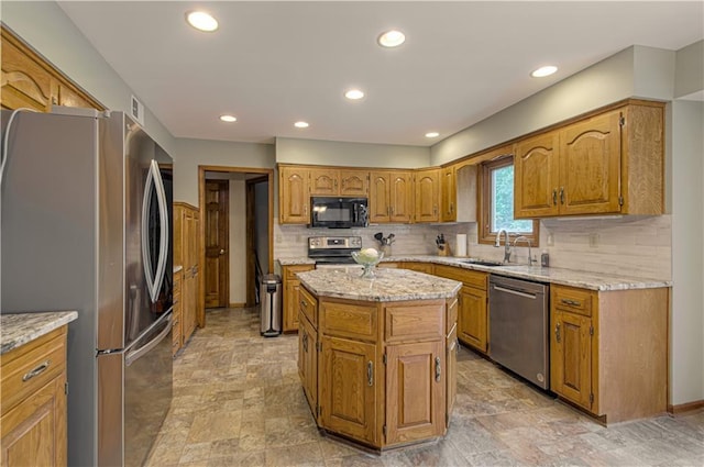 17725 W 68th Ter, Shawnee, KS 66217 - kitchen featuring stainless steel appliances, a sink, backsplash, brown cabinets, and recessed lighting