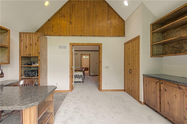 17725 W 68th Ter, Shawnee, KS 66217 - kitchen with open shelves, dark countertops, light carpet, baseboards, and recessed lighting