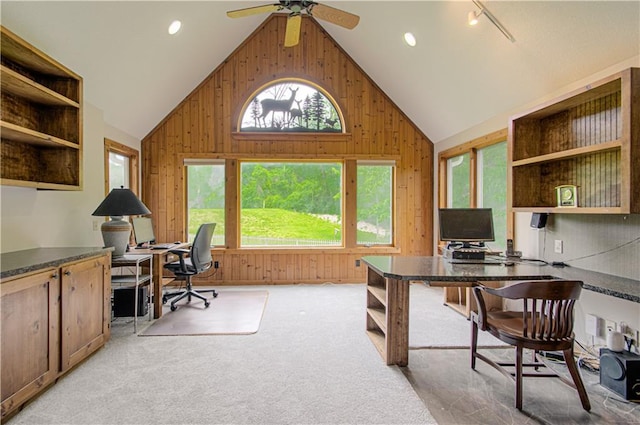 17725 W 68th Ter, Shawnee, KS 66217 - office area featuring wooden walls, a ceiling fan, and high vaulted ceiling