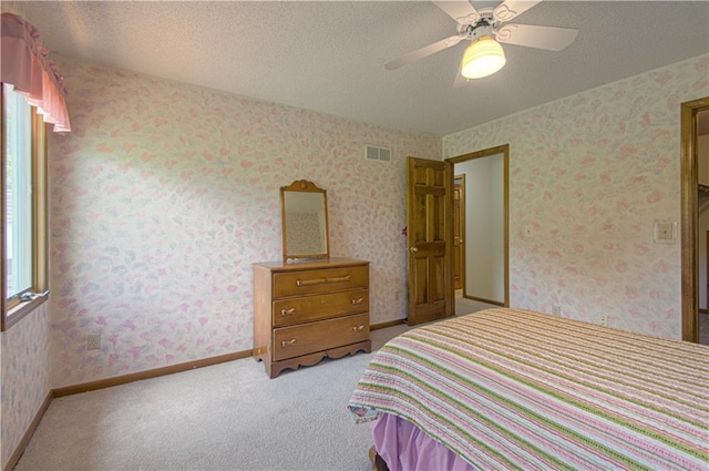 17725 W 68th Ter, Shawnee, KS 66217 - bedroom with light carpet, a textured ceiling, and ceiling fan