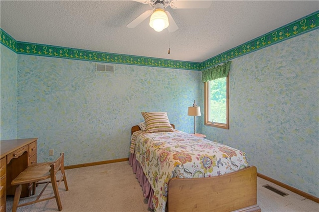 17725 W 68th Ter, Shawnee, KS 66217 - bedroom with wallpapered walls, a textured ceiling, light colored carpet, baseboards, and ceiling fan