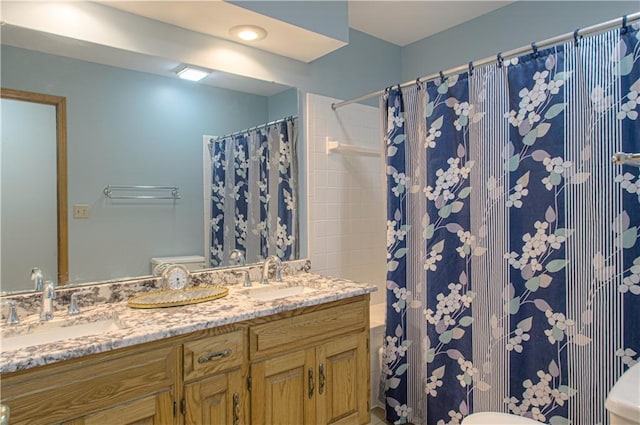17725 W 68th Ter, Shawnee, KS 66217 - bathroom featuring toilet, double vanity, and a shower with shower curtain