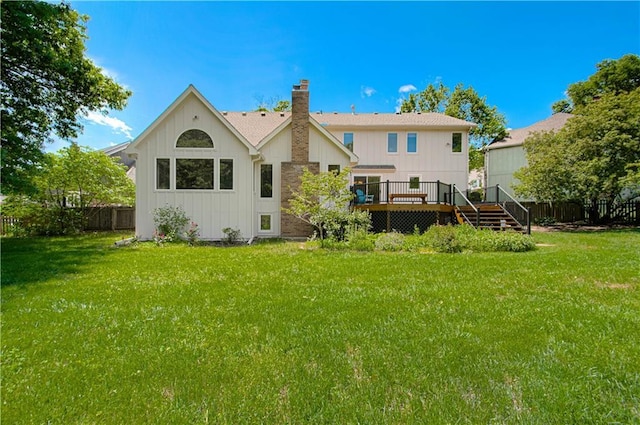 17725 W 68th Ter, Shawnee, KS 66217 - back of property with a deck, a chimney, board and batten siding, and stairs