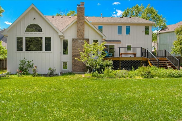 17725 W 68th Ter, Shawnee, KS 66217 - rear view of house featuring board and batten siding, a deck, a chimney, and a lawn