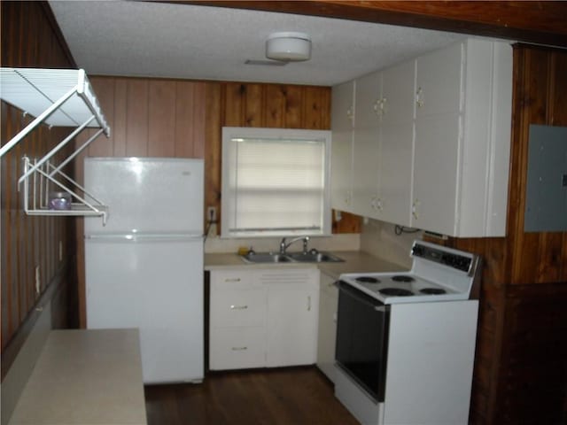 1903-05 High Grove Rd, Grandview, MO 64030 - kitchen featuring white appliances, a sink, electric panel, light countertops, and white cabinets
