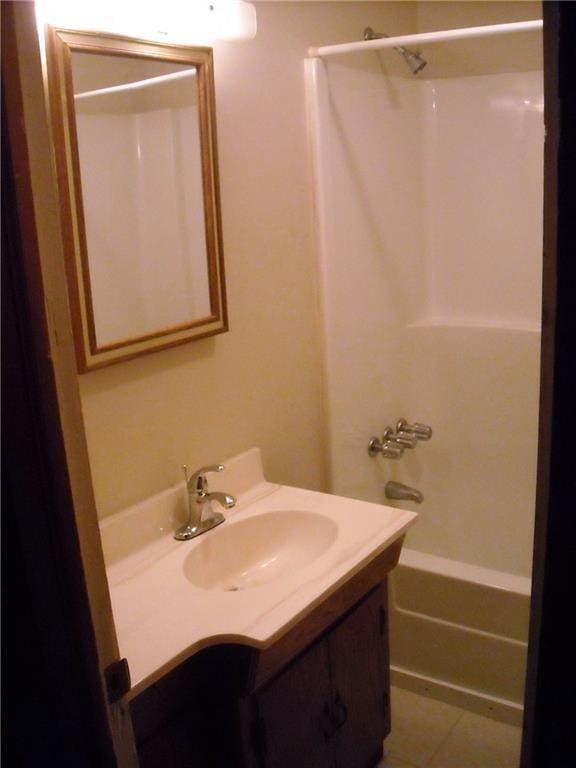 1903-05 High Grove Rd, Grandview, MO 64030 - bathroom with vanity and bathing tub / shower combination