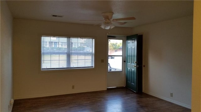 1903-05 High Grove Rd, Grandview, MO 64030 - entryway with wood finished floors, ceiling fan, and baseboards