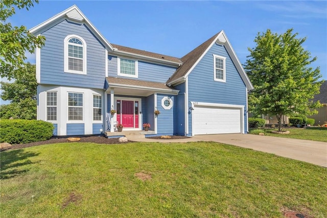 635 N Laurel St, Gardner, KS 66030 - traditional-style home featuring concrete driveway, a front yard, and an attached garage