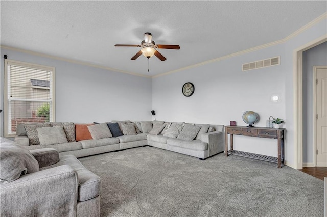 635 N Laurel St, Gardner, KS 66030 - carpeted living room with ceiling fan, ornamental molding, a textured ceiling, and baseboards