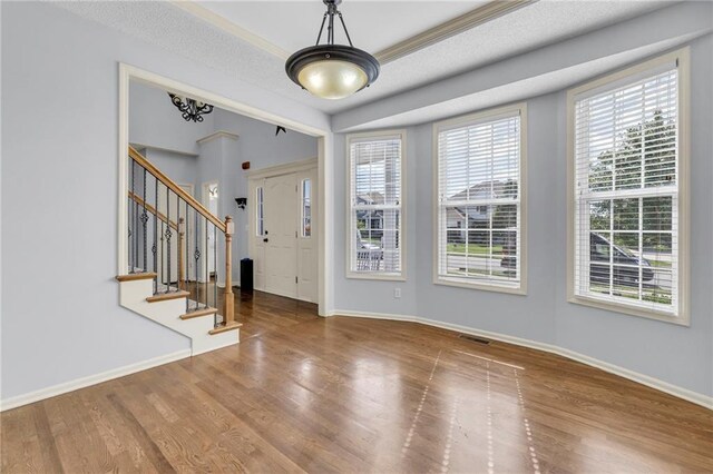 635 N Laurel St, Gardner, KS 66030 - entrance foyer with baseboards, stairway, and wood finished floors
