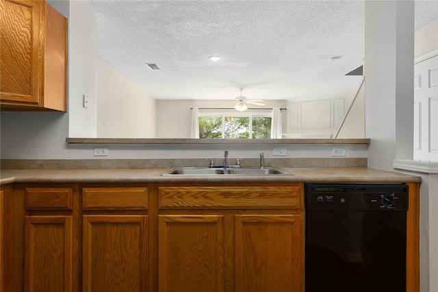 5412 Fairmount Ave, Kansas City, MO 64118 - kitchen with black dishwasher, a sink, a textured ceiling, ceiling fan, and brown cabinetry