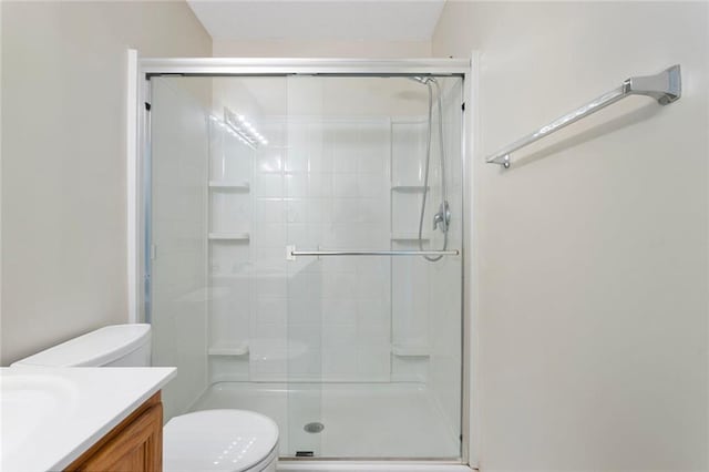 5412 Fairmount Ave, Kansas City, MO 64118 - full bath with toilet, vanity, and a stall shower