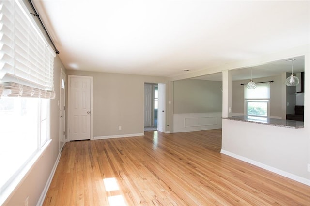 7048 Horton St, Overland Park, KS 66204 - unfurnished room featuring light wood-style floors and a wainscoted wall
