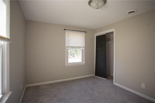 7048 Horton St, Overland Park, KS 66204 - unfurnished bedroom featuring carpet flooring, a closet, and baseboards