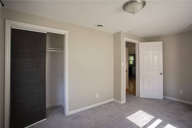 7048 Horton St, Overland Park, KS 66204 - unfurnished bedroom featuring carpet, a closet, and baseboards