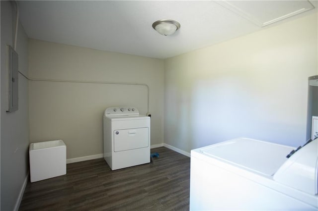 7048 Horton St, Overland Park, KS 66204 - washroom with washer and dryer, dark wood-style flooring, electric panel, and baseboards