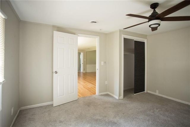 7048 Horton St, Overland Park, KS 66204 - unfurnished bedroom featuring carpet flooring, baseboards, a closet, and ceiling fan
