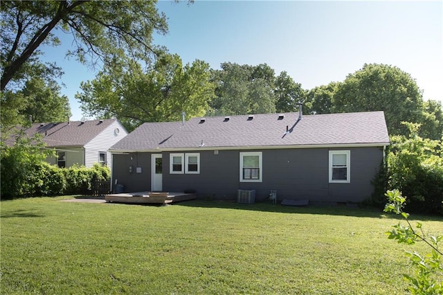 7048 Horton St, Overland Park, KS 66204 - back of property featuring a yard, a deck, and cooling unit