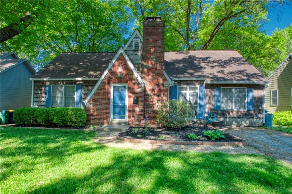 5332 Birch St, Roeland Park, KS 66205 - tudor home with a chimney and a front yard