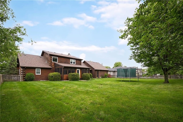 611 N Winnebago Dr, Lake Winnebago, MO 64034 - back of property with a trampoline, a sunroom, and log exterior