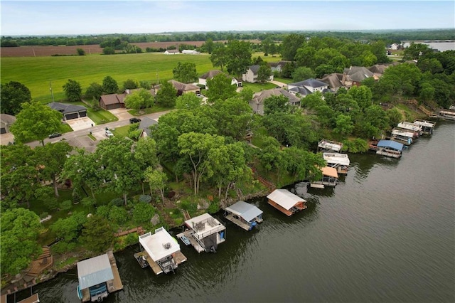 611 N Winnebago Dr, Lake Winnebago, MO 64034 - drone / aerial view of a nearby body of water and a tree filled landscape