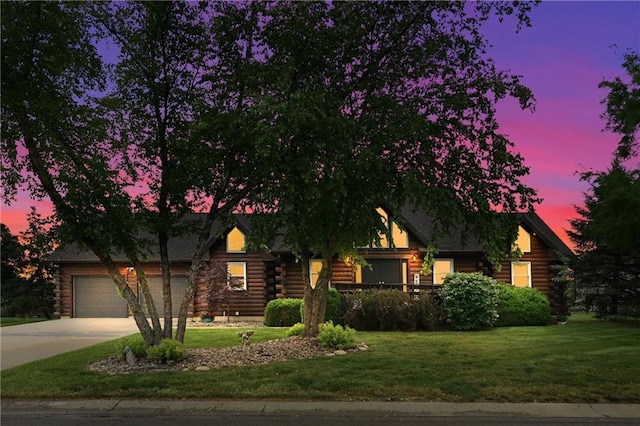 611 N Winnebago Dr, Lake Winnebago, MO 64034 - log-style house with log exterior, a yard, concrete driveway, and a garage