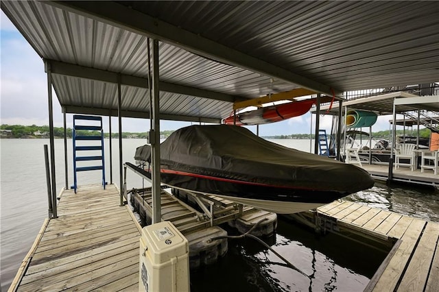 611 N Winnebago Dr, Lake Winnebago, MO 64034 - dock featuring boat lift and a water view